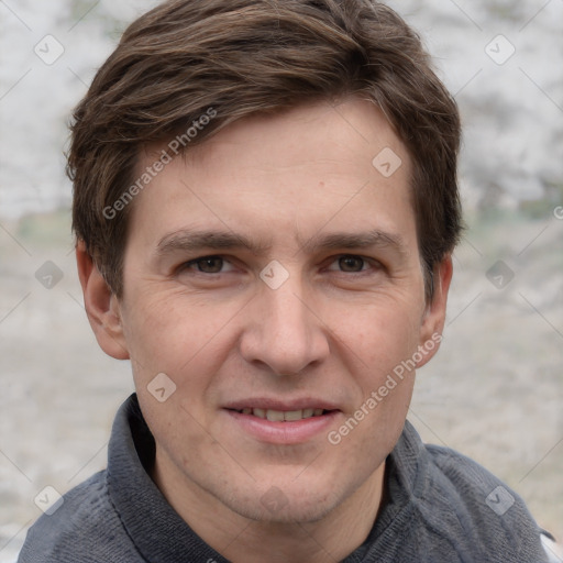 Joyful white adult male with short  brown hair and grey eyes