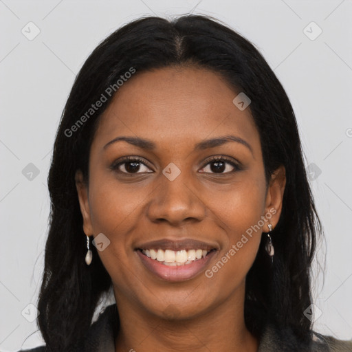 Joyful black young-adult female with long  black hair and brown eyes