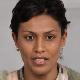 Joyful latino young-adult female with short  brown hair and brown eyes