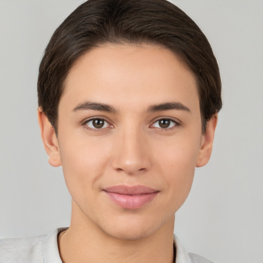 Joyful white young-adult female with short  brown hair and brown eyes