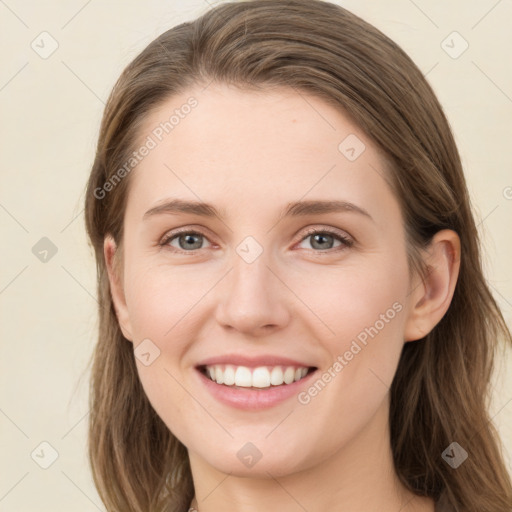 Joyful white young-adult female with long  brown hair and grey eyes