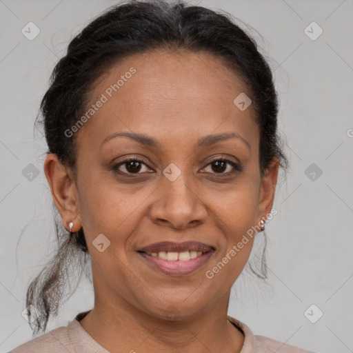 Joyful black adult female with short  brown hair and brown eyes