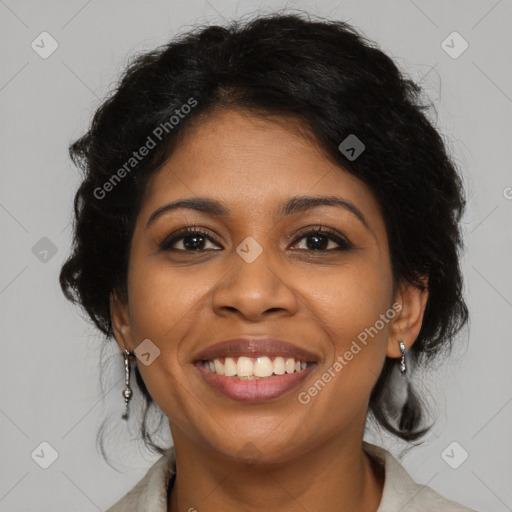 Joyful black young-adult female with long  brown hair and brown eyes