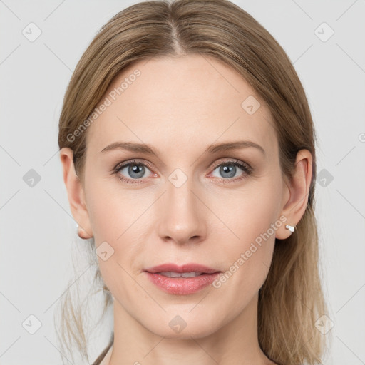 Joyful white young-adult female with long  brown hair and blue eyes