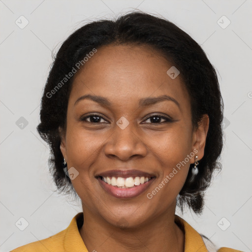 Joyful black young-adult female with medium  brown hair and brown eyes