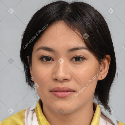 Joyful asian young-adult female with medium  brown hair and brown eyes