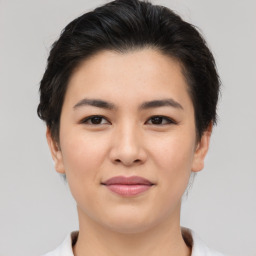 Joyful asian young-adult female with short  brown hair and brown eyes