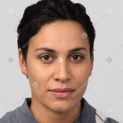 Joyful latino young-adult female with short  brown hair and brown eyes