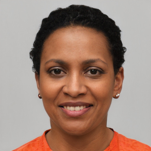 Joyful latino young-adult female with short  black hair and brown eyes