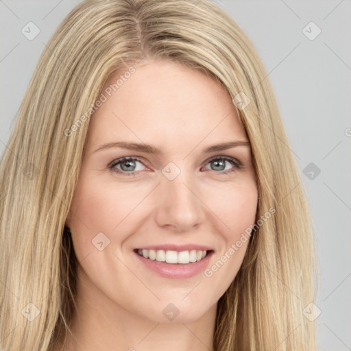 Joyful white young-adult female with long  brown hair and blue eyes