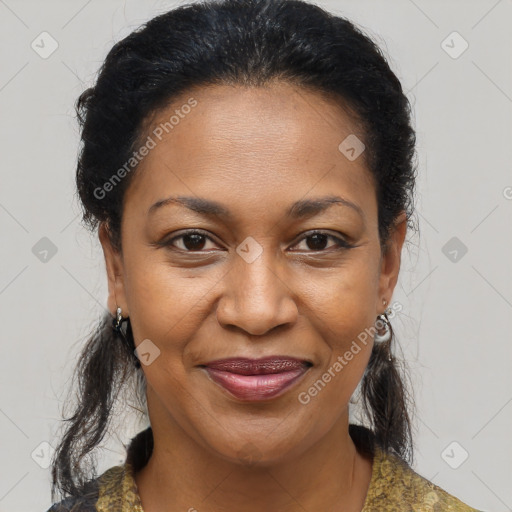 Joyful black adult female with medium  brown hair and brown eyes