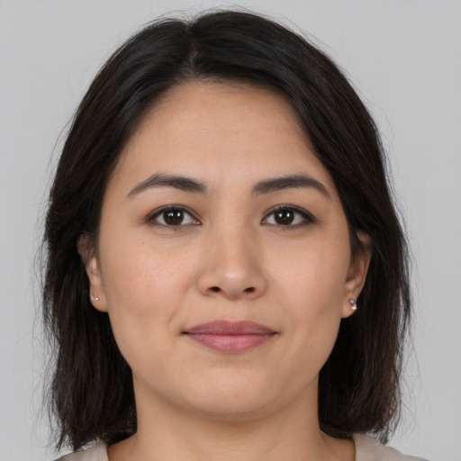 Joyful asian young-adult female with medium  brown hair and brown eyes