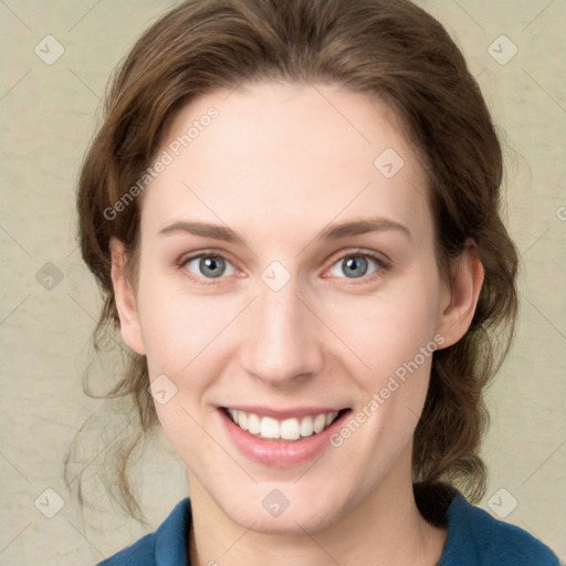 Joyful white young-adult female with medium  brown hair and green eyes