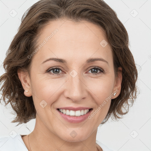 Joyful white adult female with medium  brown hair and grey eyes