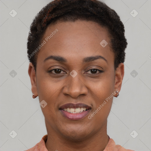 Joyful black young-adult female with short  black hair and brown eyes