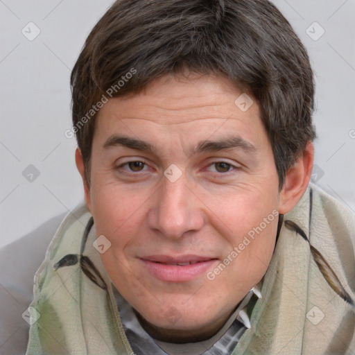 Joyful white adult male with short  brown hair and brown eyes