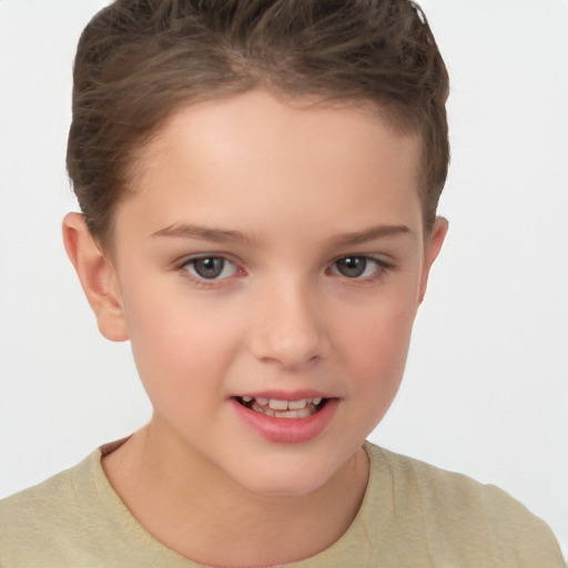 Joyful white child female with short  brown hair and brown eyes