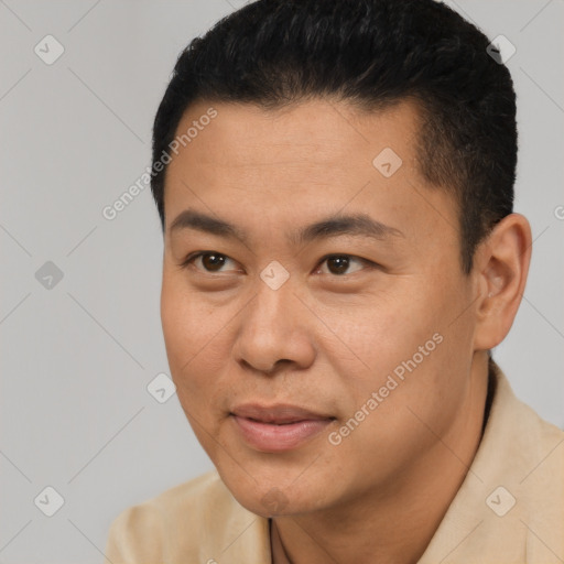 Joyful latino young-adult male with short  black hair and brown eyes