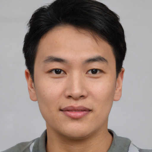 Neutral asian young-adult male with short  brown hair and brown eyes