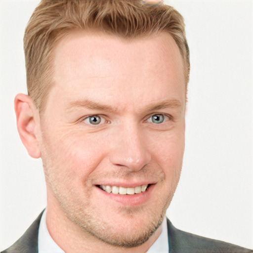 Joyful white adult male with short  brown hair and blue eyes