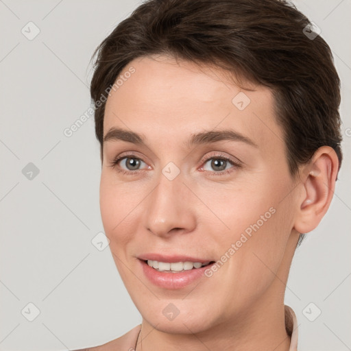 Joyful white young-adult female with short  brown hair and brown eyes