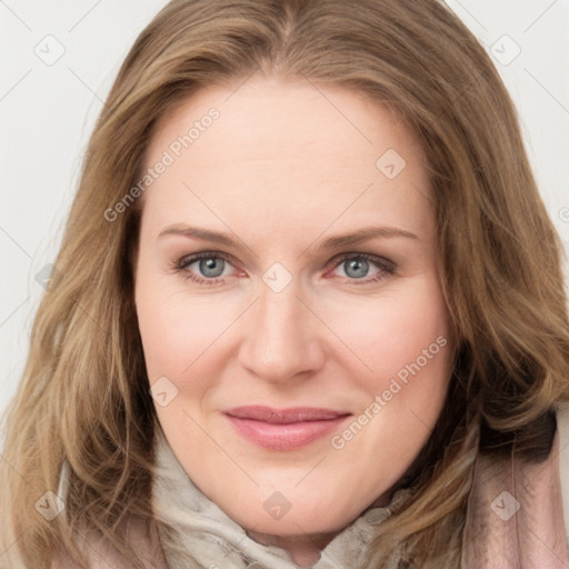 Joyful white young-adult female with long  brown hair and blue eyes