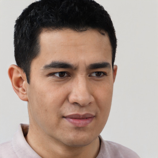 Joyful latino young-adult male with short  brown hair and brown eyes