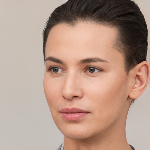 Joyful white young-adult female with short  brown hair and brown eyes