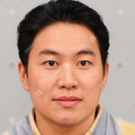 Joyful asian young-adult male with short  brown hair and brown eyes