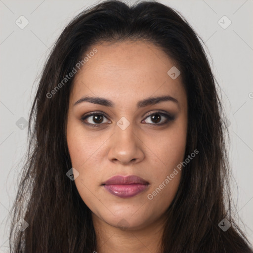 Joyful latino young-adult female with long  brown hair and brown eyes