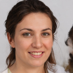 Joyful white young-adult female with medium  brown hair and brown eyes