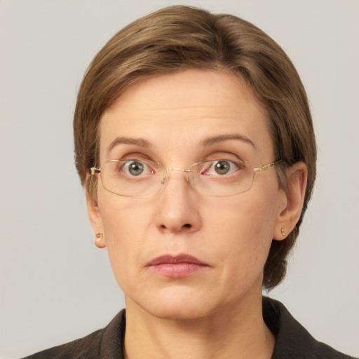 Neutral white adult female with short  brown hair and grey eyes