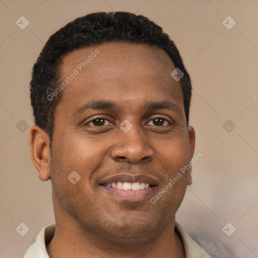 Joyful latino young-adult male with short  brown hair and brown eyes