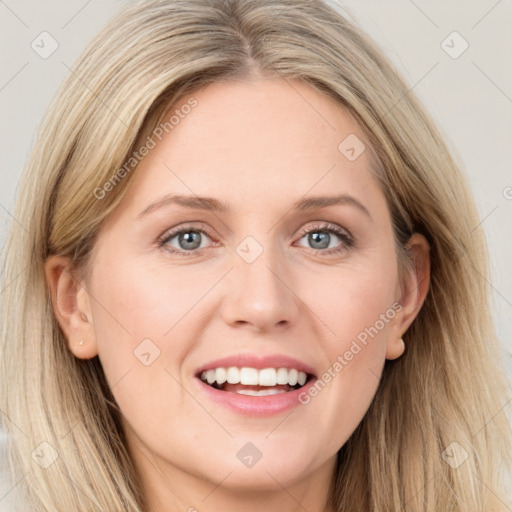 Joyful white young-adult female with long  brown hair and blue eyes