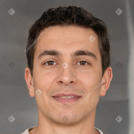 Joyful white young-adult male with short  brown hair and brown eyes