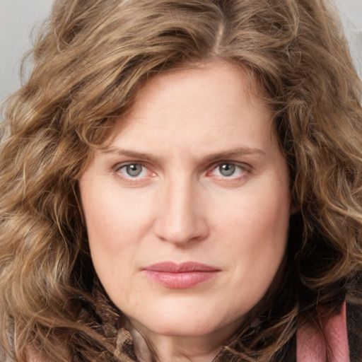 Joyful white young-adult female with long  brown hair and green eyes