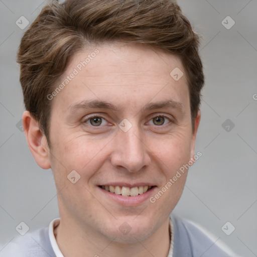 Joyful white adult male with short  brown hair and grey eyes