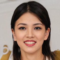 Joyful asian young-adult female with long  brown hair and brown eyes