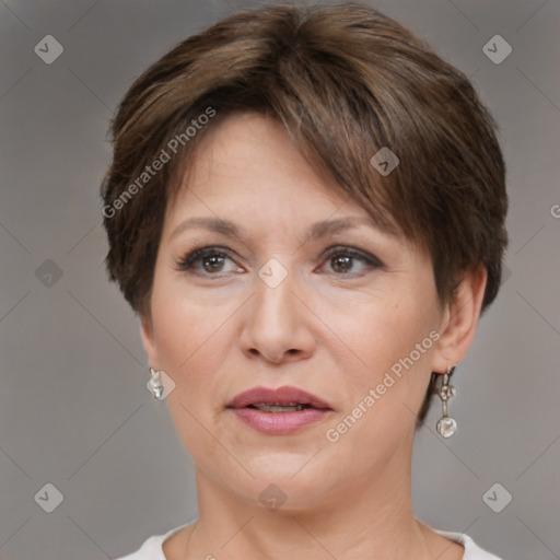 Joyful white adult female with short  brown hair and brown eyes