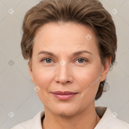 Joyful white adult female with short  brown hair and grey eyes