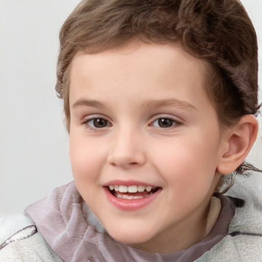 Joyful white child female with short  brown hair and brown eyes