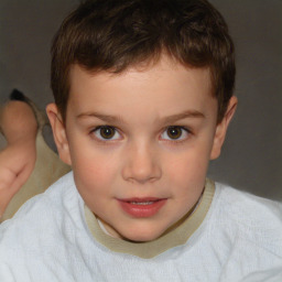 Joyful white child male with short  brown hair and brown eyes