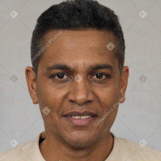 Joyful black young-adult male with short  brown hair and brown eyes