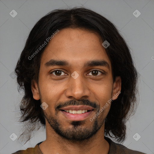 Joyful black young-adult male with medium  black hair and brown eyes