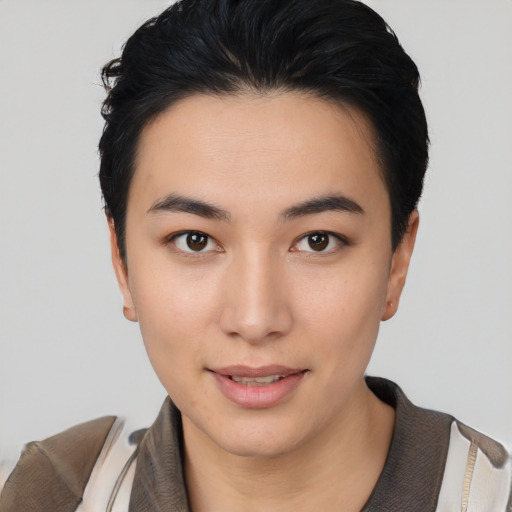 Joyful asian young-adult female with short  black hair and brown eyes