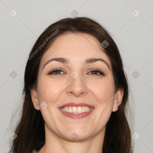 Joyful white young-adult female with long  brown hair and brown eyes