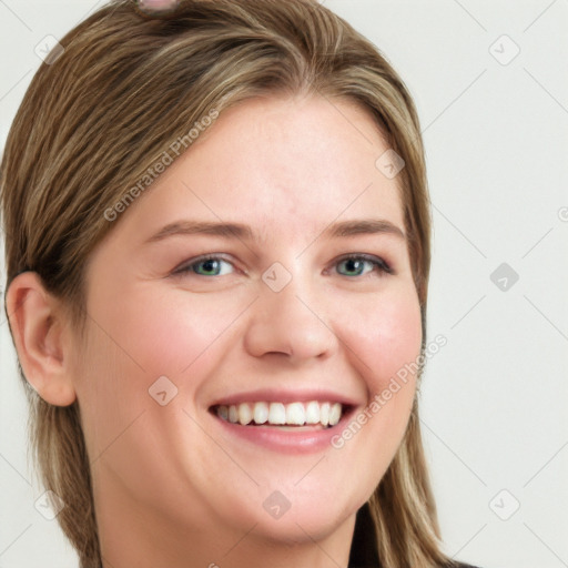 Joyful white young-adult female with long  brown hair and blue eyes