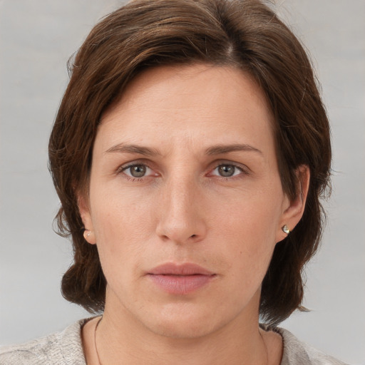 Neutral white adult female with short  brown hair and grey eyes