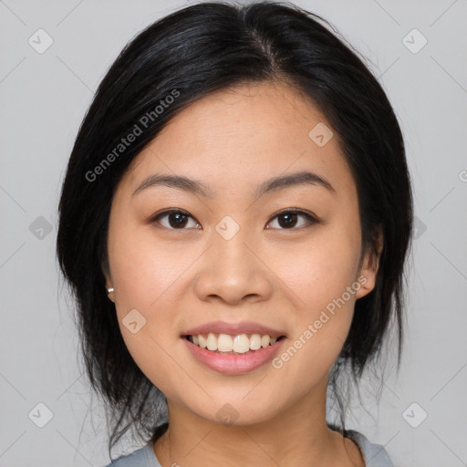 Joyful asian young-adult female with medium  black hair and brown eyes