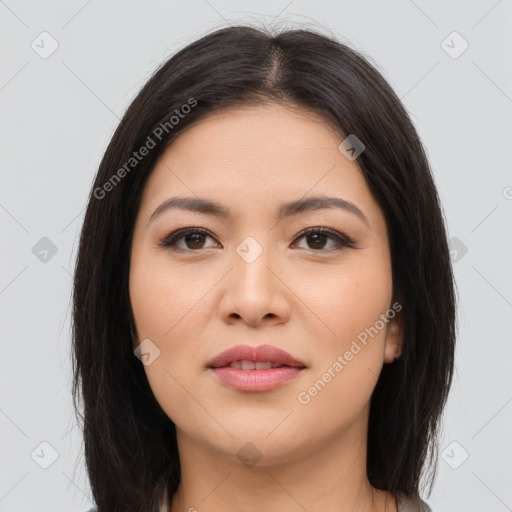 Joyful latino young-adult female with long  brown hair and brown eyes